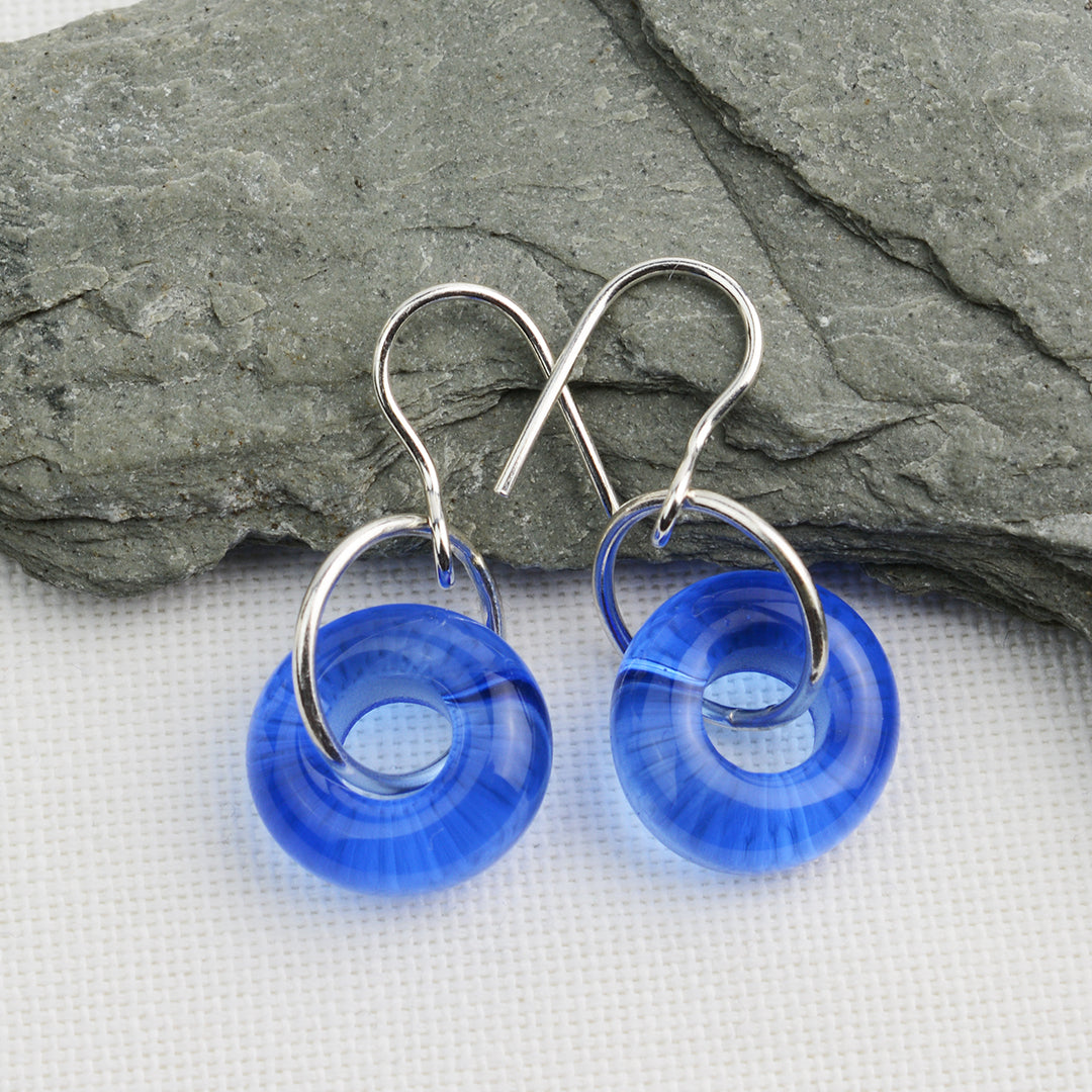 Blue glass doughnut shaped beads on silver drop earrings