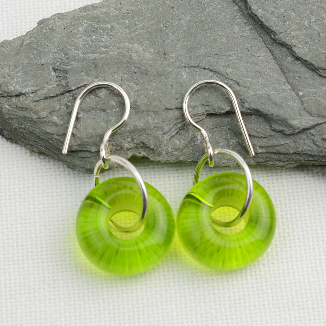Lime green glass doughnut shaped beads on silver drop earrings