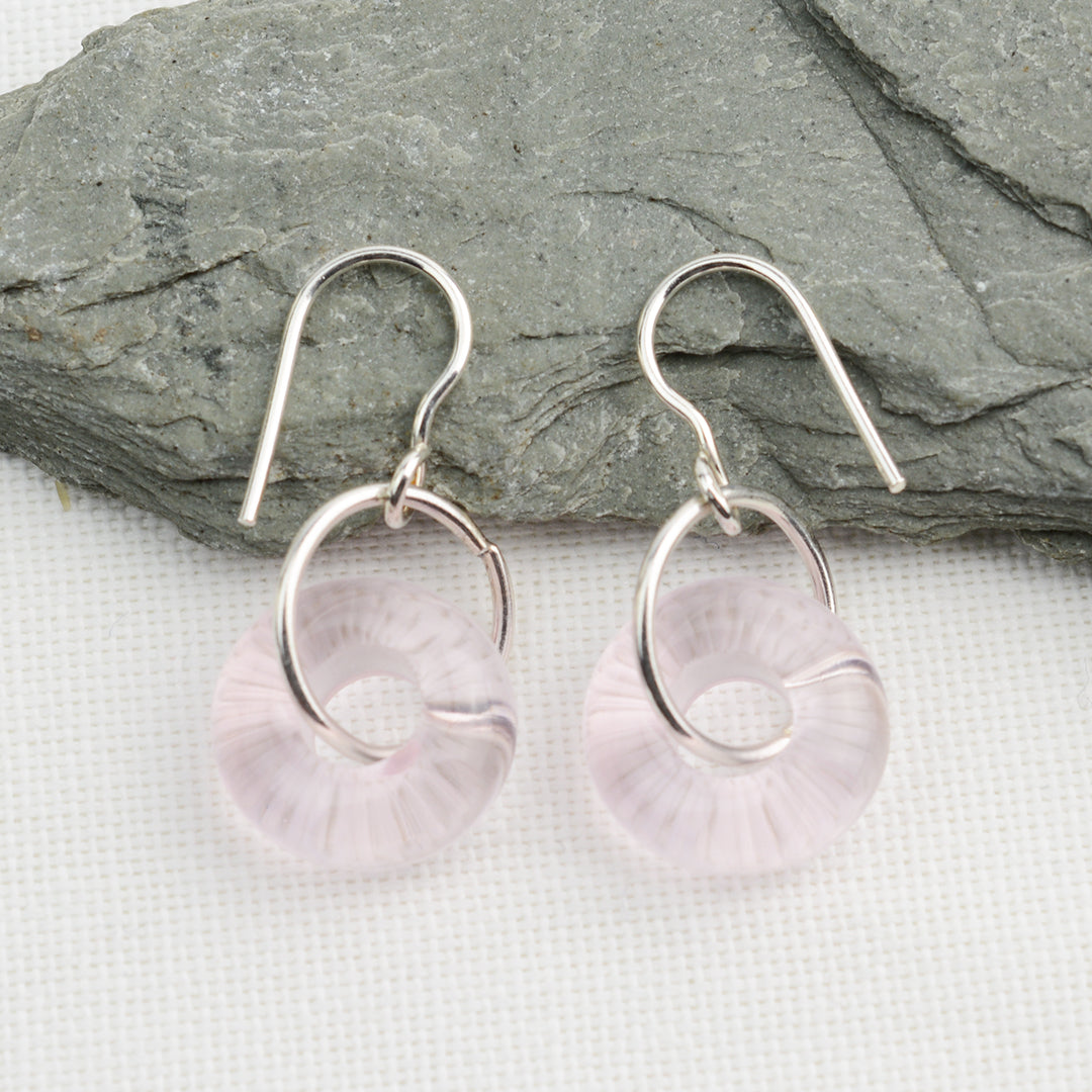 Doughnut shaped pale pink glass beads on silver drop earring hooks