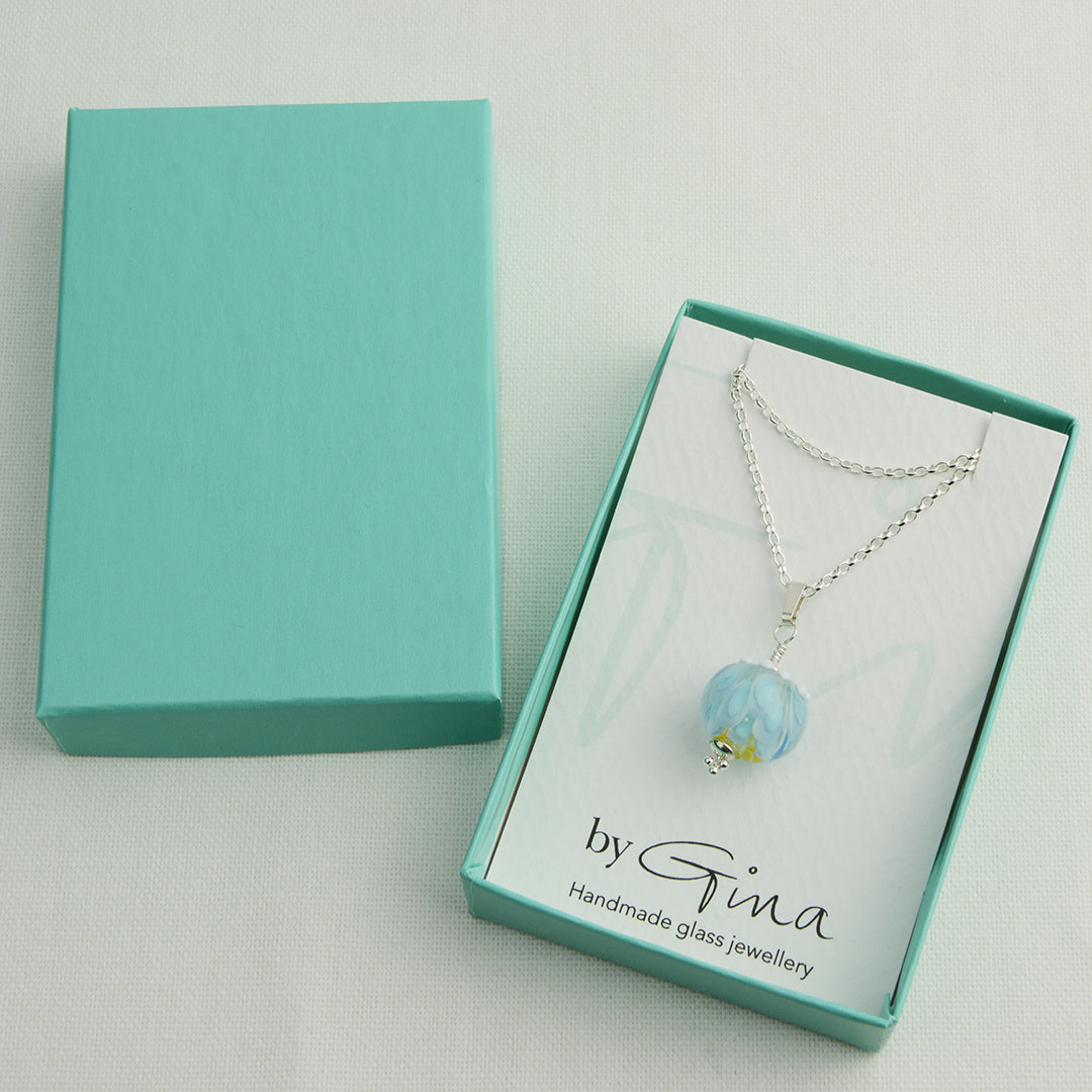 Pale blue and white glass beads imploded flower pendant on silver chain in turquoise gift box
