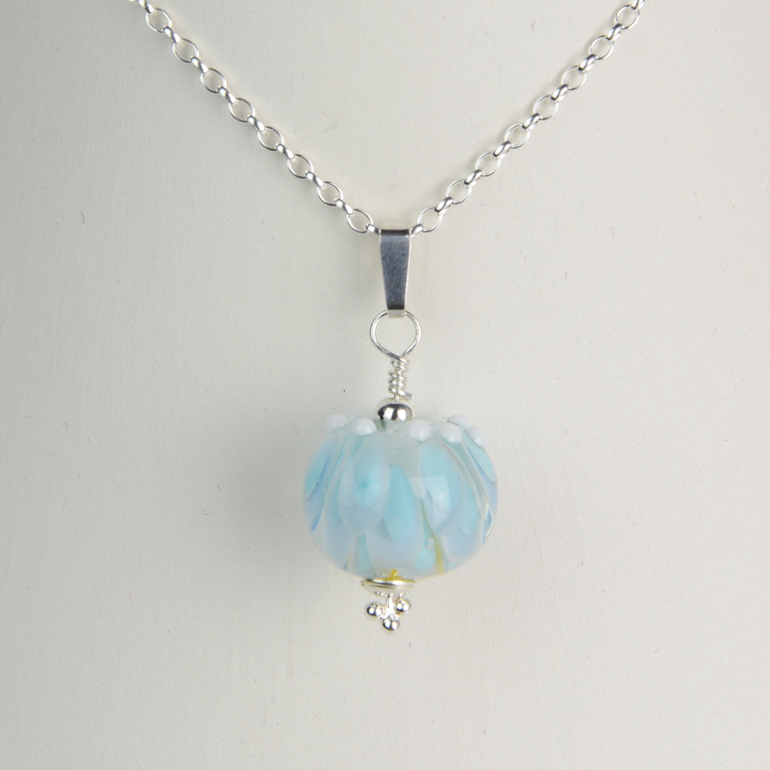 Pale blue and white glass beads imploded flower pendant on silver chain