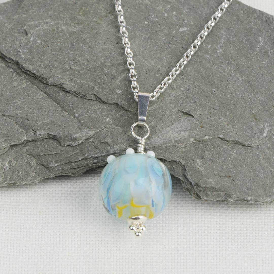 Pale blue and white glass beads imploded flower pendant on silver chain