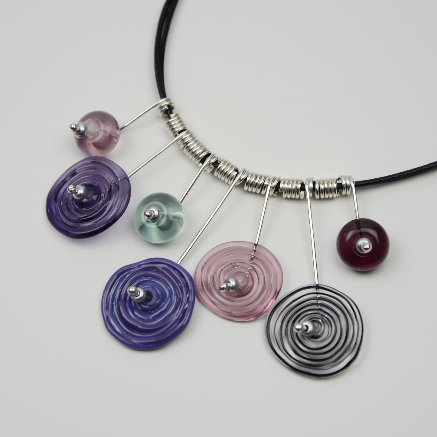 Spiral drop necklace in purple, black & grey, 7 bead
