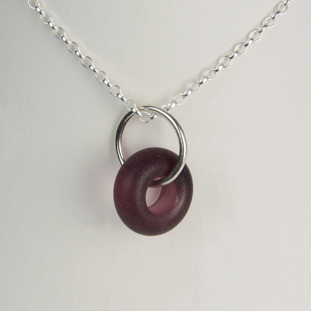 Etched purple glass doughnut shaped bead pendant on silver chain