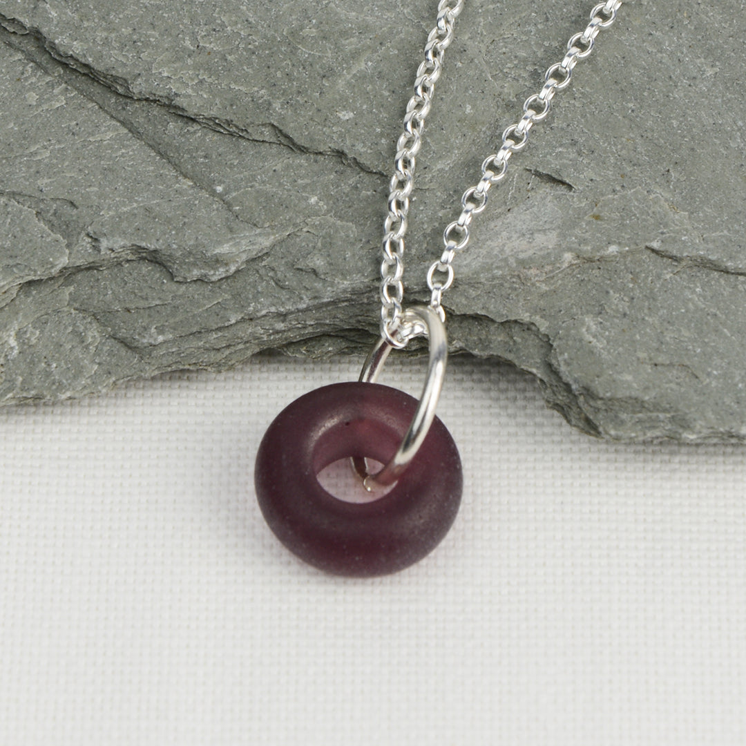 Etched purple glass doughnut shaped bead pendant on silver chain