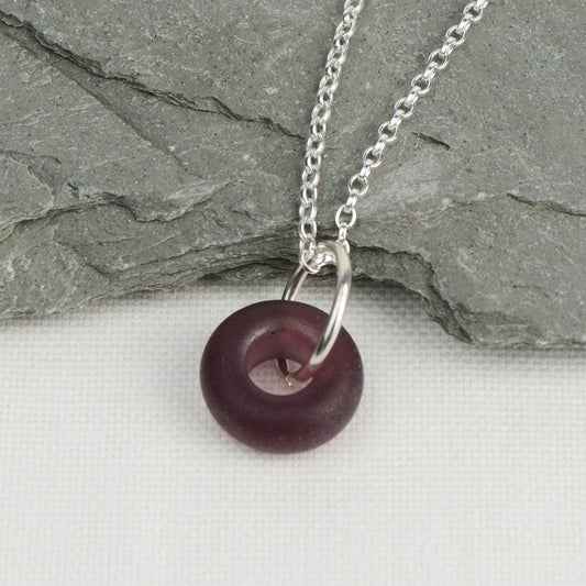 Etched purple glass doughnut shaped bead pendant on silver chain