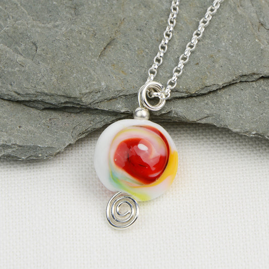 Multi coloured swirly lentil shaped glass bead pendant  on silver chain