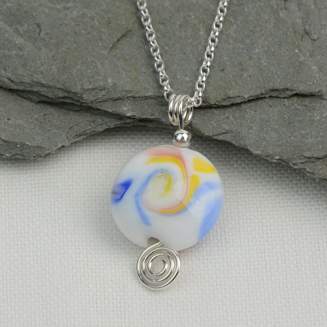 Multi coloured swirly lentil shaped glass bead pendant  on silver chain