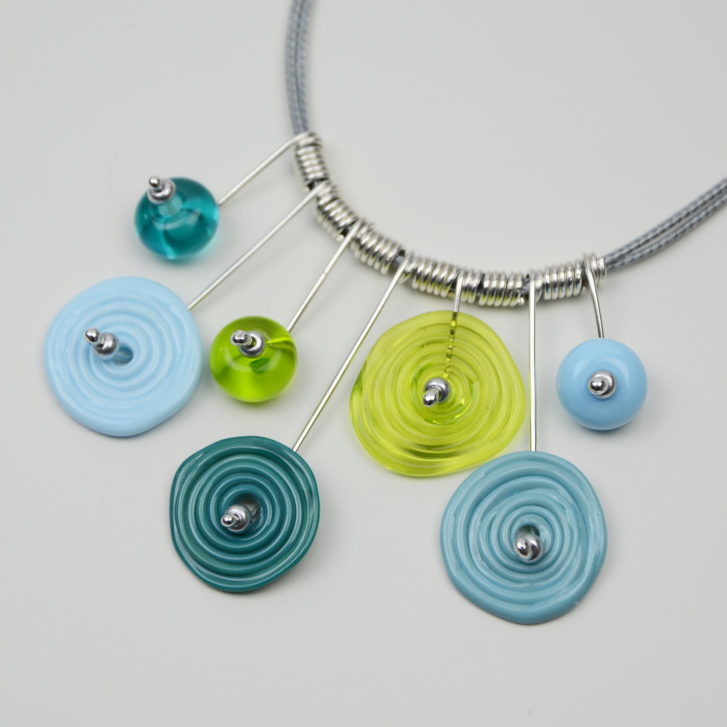 Spiral drop necklace in teal, turquoise & lime green, 7 bead