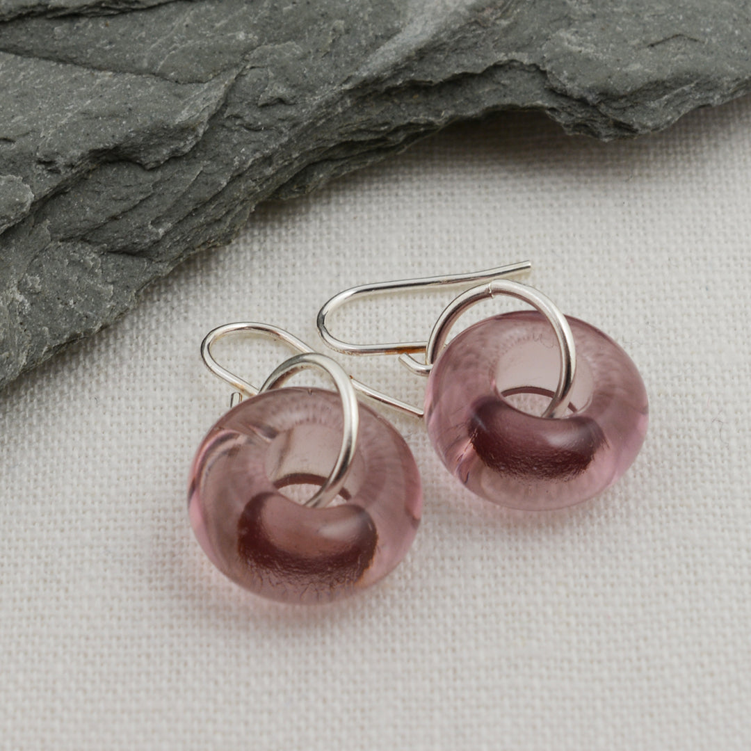 Doughnut shaped amethyst glass beads on silver drop earring hooks