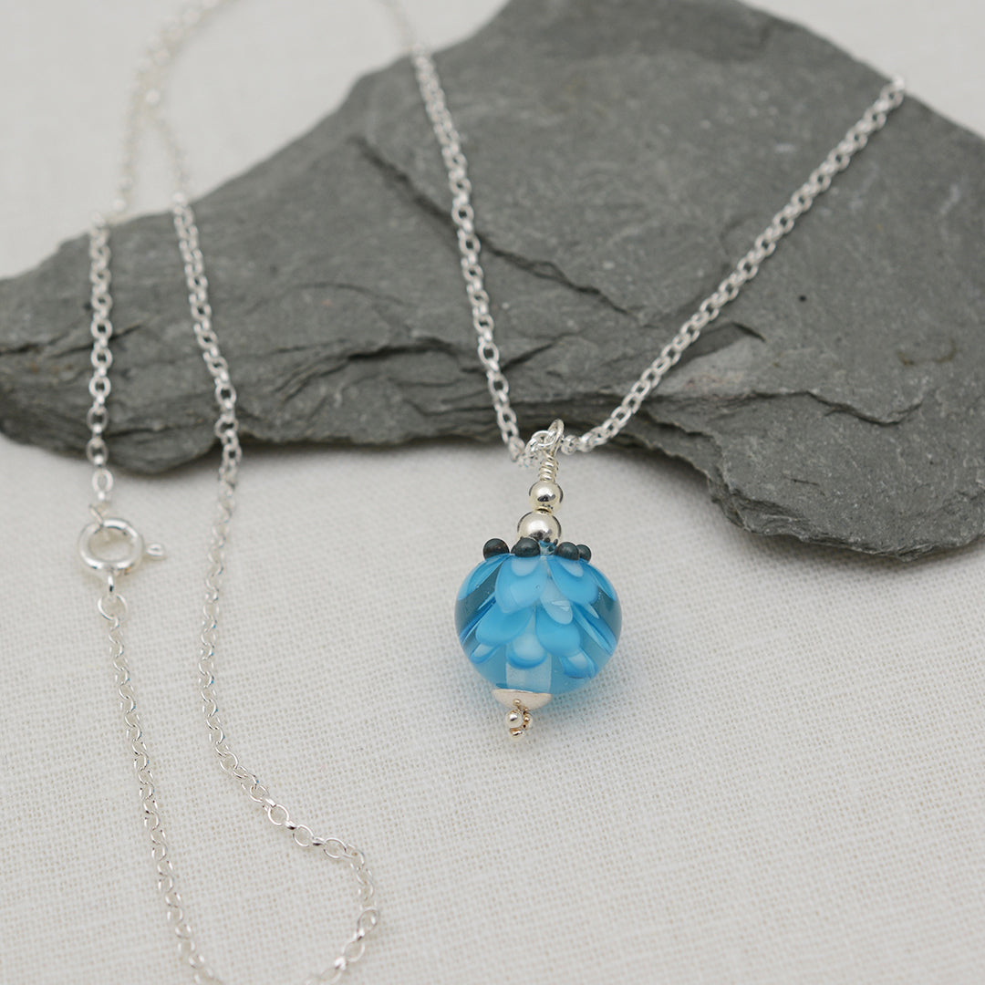 Turquoise glass beads imploded flower pendant on silver chain