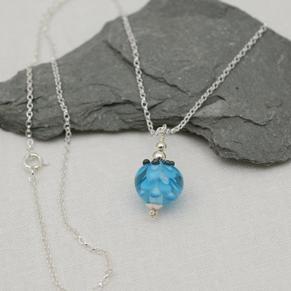 Turquoise glass beads imploded flower pendant on silver chain