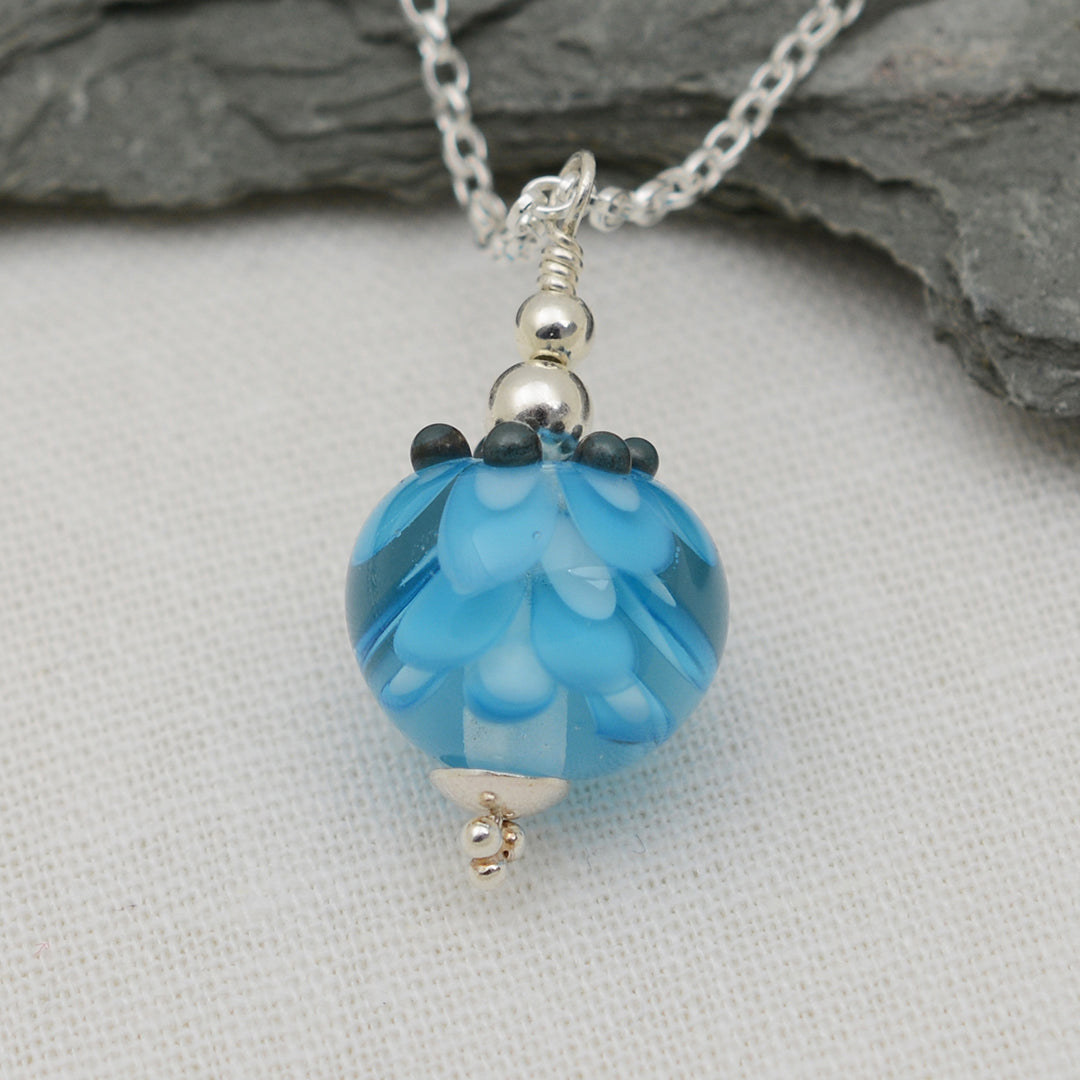 Turquoise glass beads imploded flower pendant on silver chain