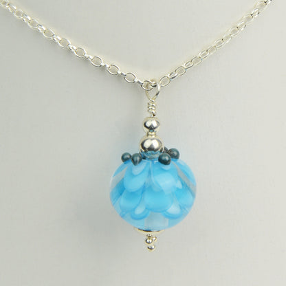 Turquoise glass beads imploded flower pendant on silver chain