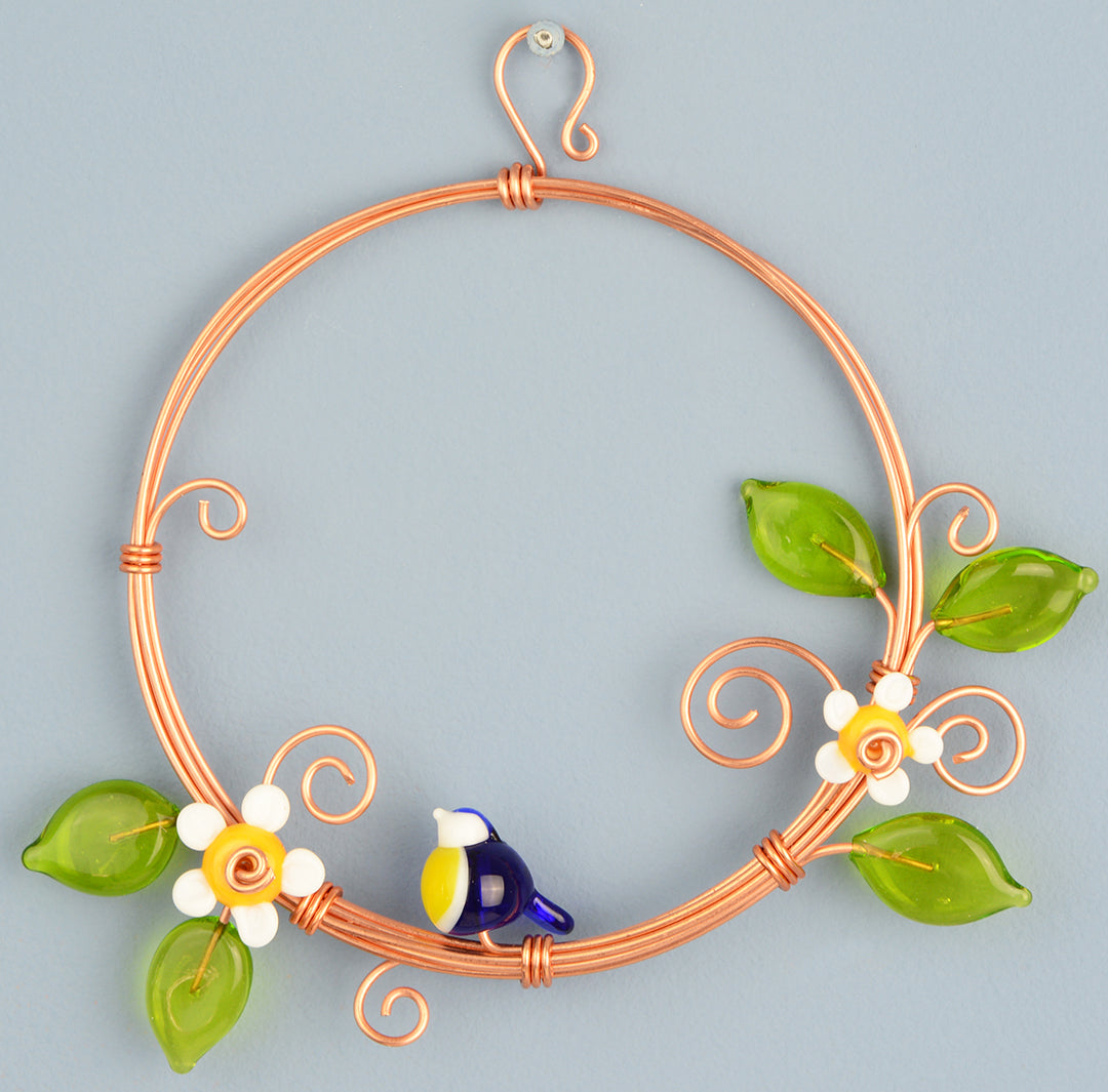 Miniature copper wreath with glass blue tit, flowers and leaves