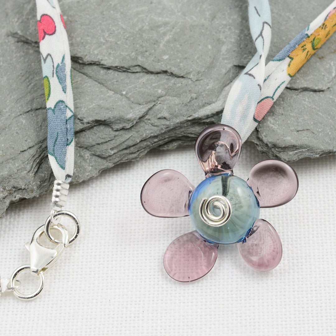Purple and grey glass flower pendant on Liberty cord necklace