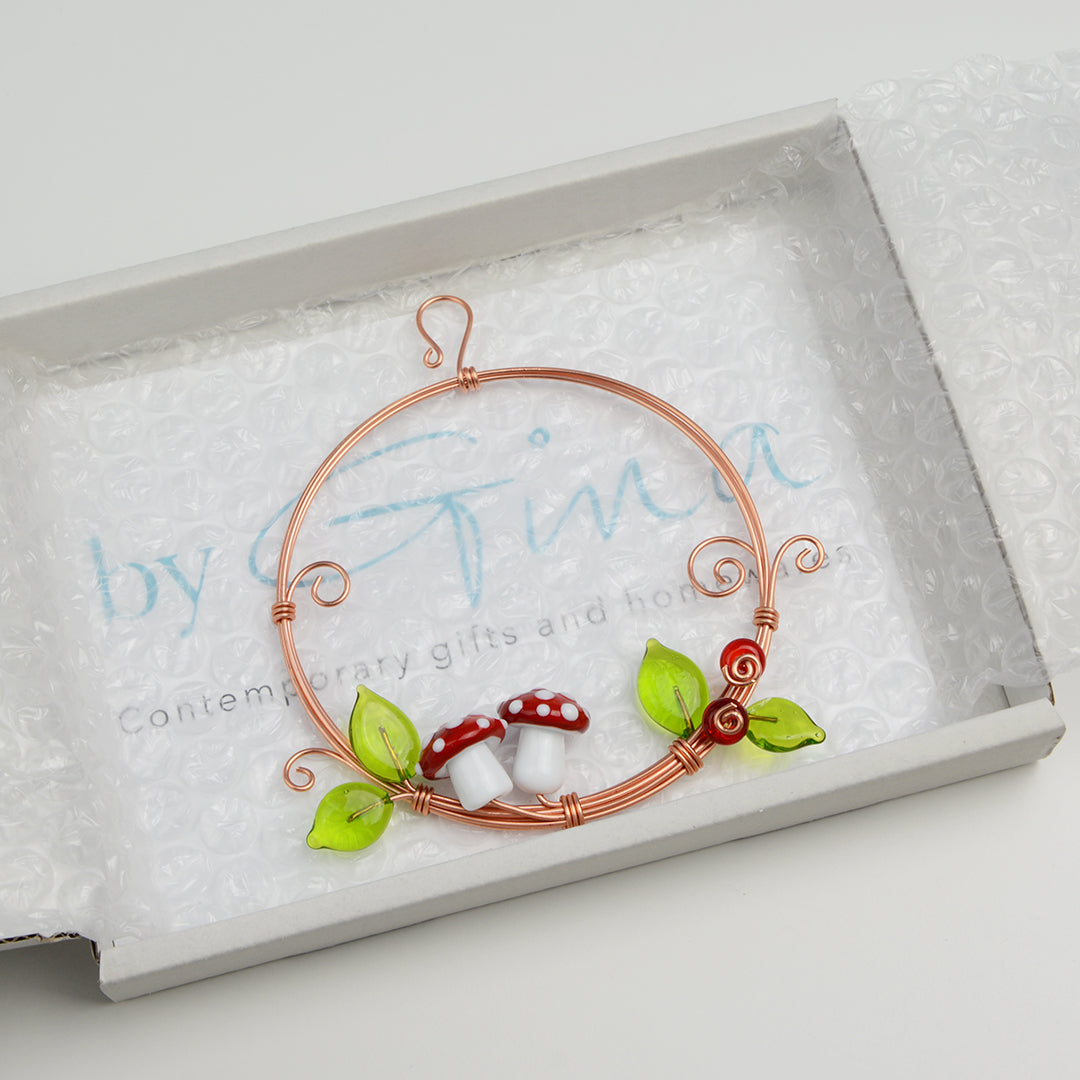 Miniature copper wreath with glass mushrooms, berries and leaves in white gift box