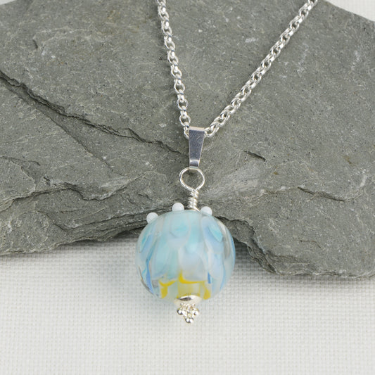 Pale blue and white glass beads imploded flower pendant on silver chain