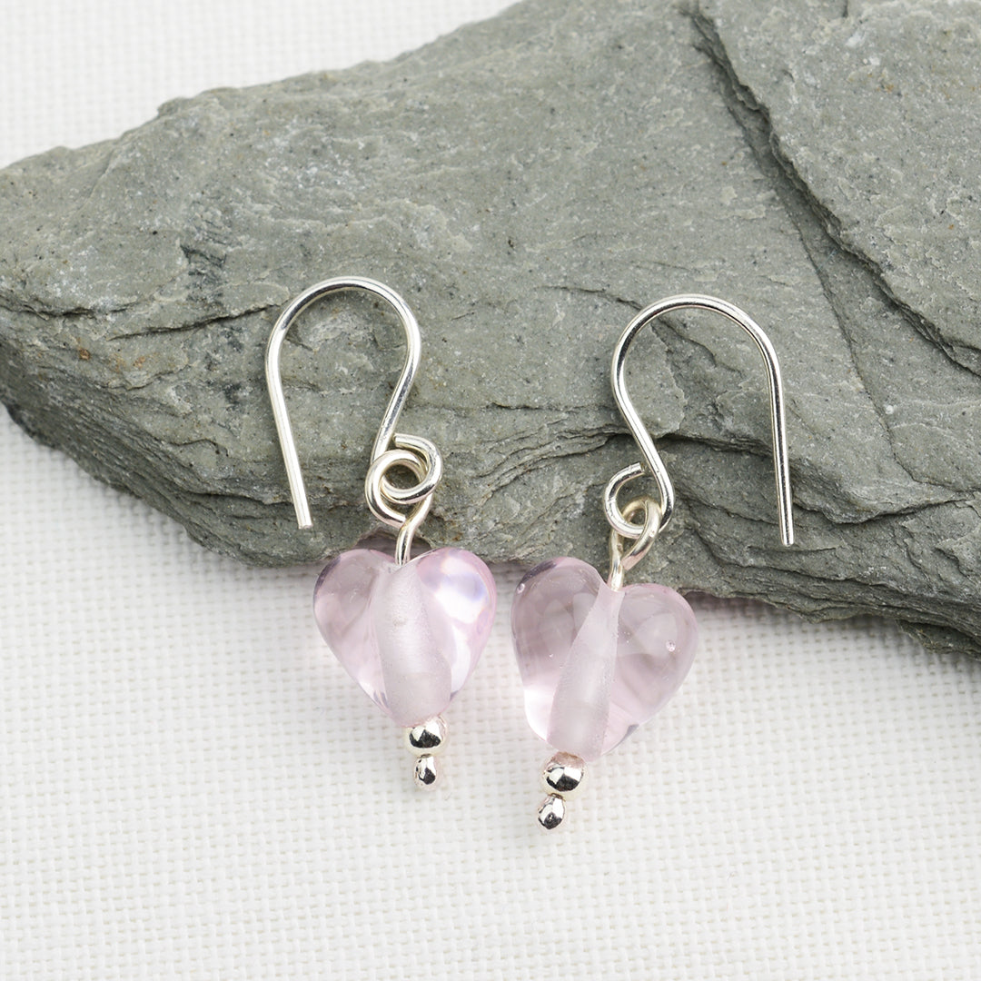 Heart shaped pale pink glass beads on silver drop earring hooks