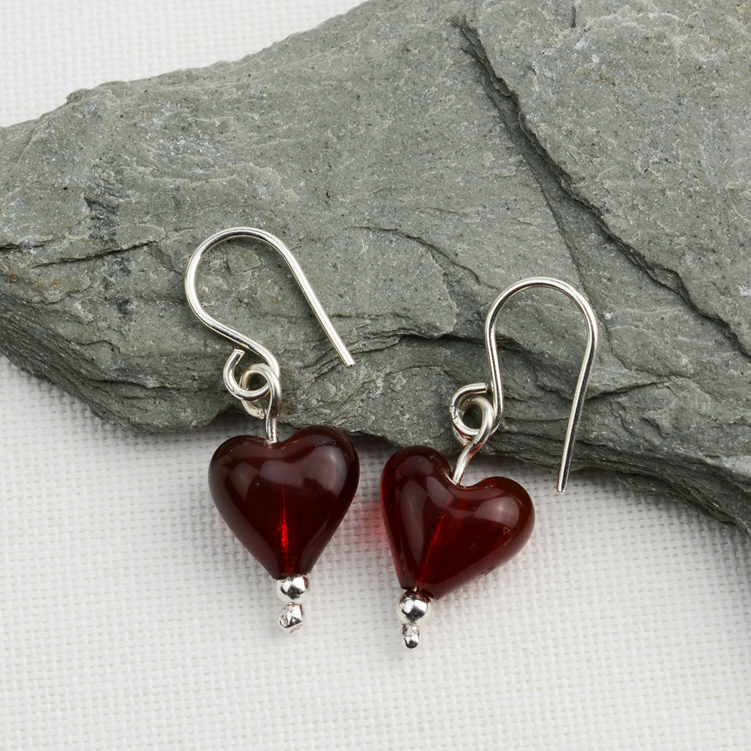 Heart shaped deep red glass beads on silver drop earring hooks