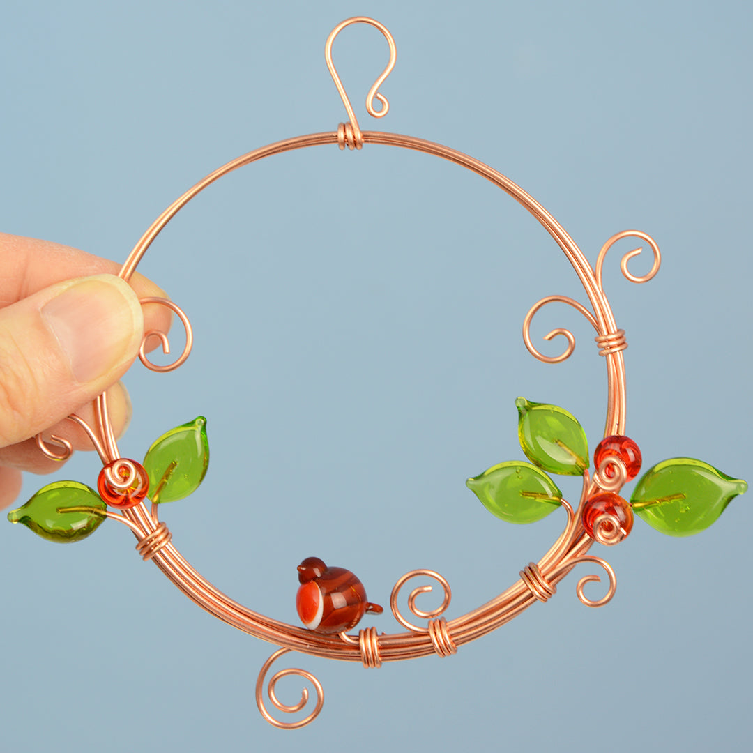 Miniature copper wreath with glass robin, berries and leaves