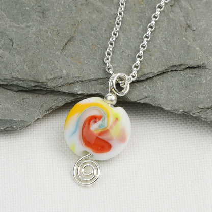 Multi coloured swirly lentil shaped glass bead pendant  on silver chain
