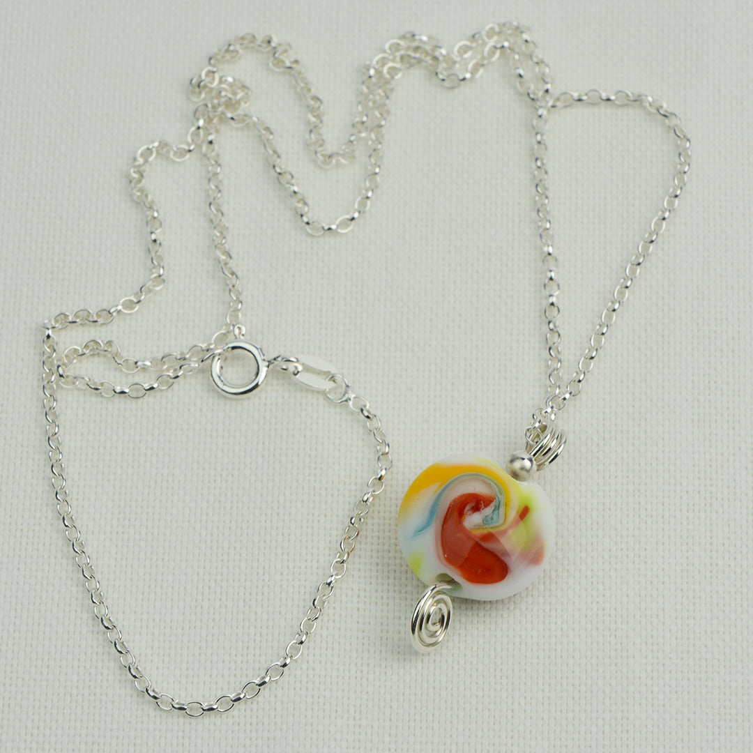Multi coloured swirly lentil shaped glass bead pendant  on silver chain