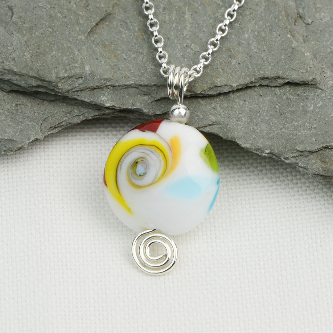 Multi coloured swirly lentil shaped glass bead pendant  on silver chain