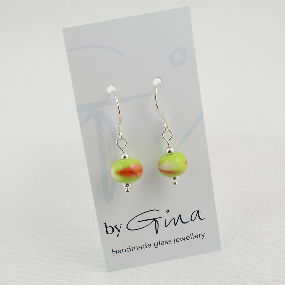 Green, white and orange beads on silver drop earrings