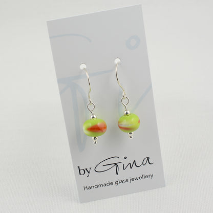 Green, white and orange beads on silver drop earrings