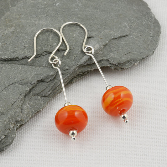 Orange glass beads on silver drop earring hooks