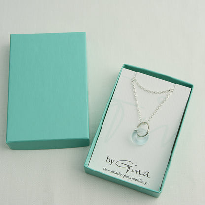 Doughnut shaped ice blue glass bead on silver chain in turquoise gift box