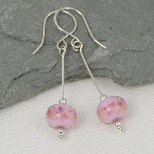 Encased pretty in pink glass bead earrings