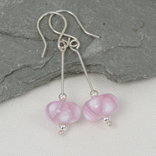 Pink and white harlequin glass bead earrings