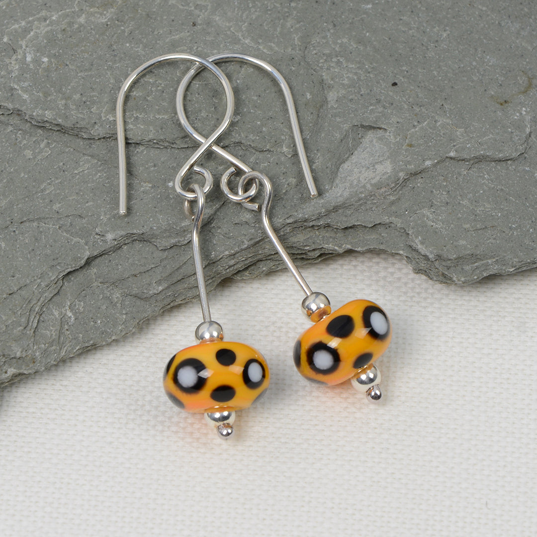 Yellow, black & white glass bead earrings
