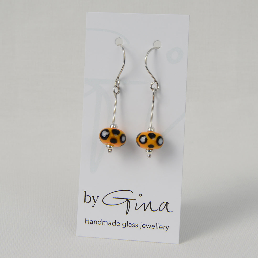 Yellow, black & white glass bead earrings