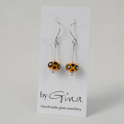 Yellow, black & white glass bead earrings